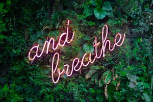 'and breath' written in neon