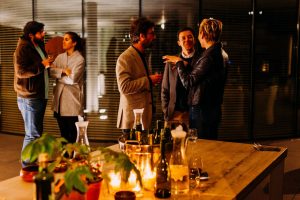 Photo of people mingling at an event. Photo by Antenna on Unsplash