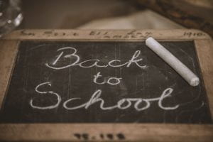 Chalkboard reading Back to School. Photo by Deleece Cook on Unsplash